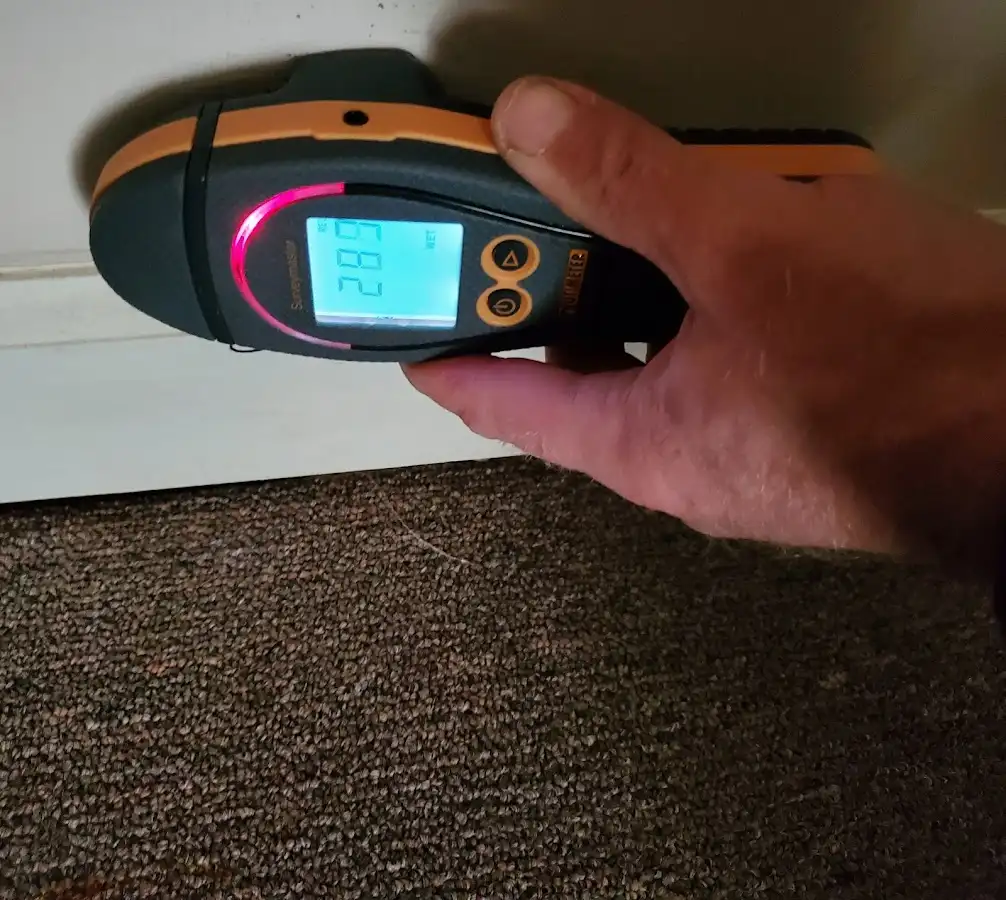 Moisture detection at baseboard during Sewage Cleanup & Sanitation in Canfield